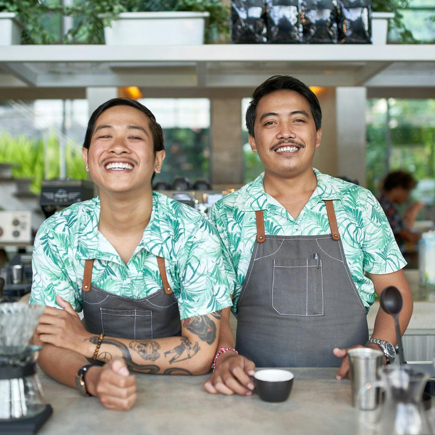 Two business owners smiling