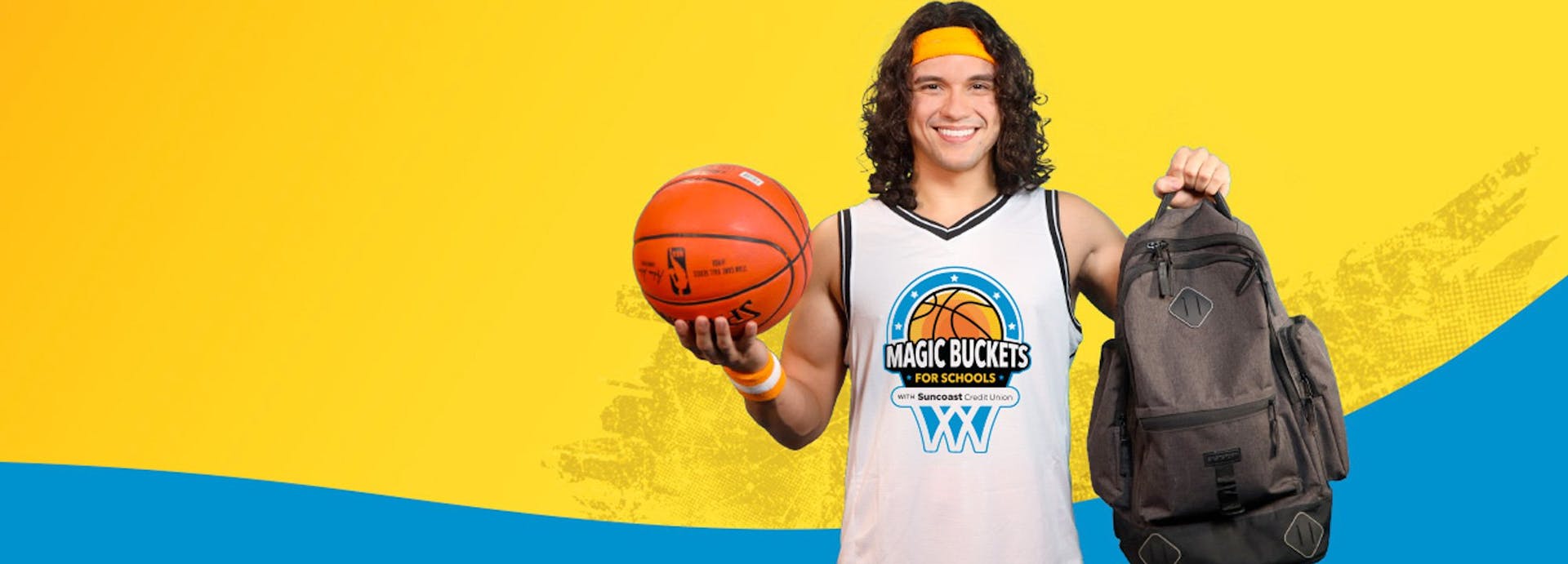 spencer the suncoast influencer holding a basketball and wearing a jersey