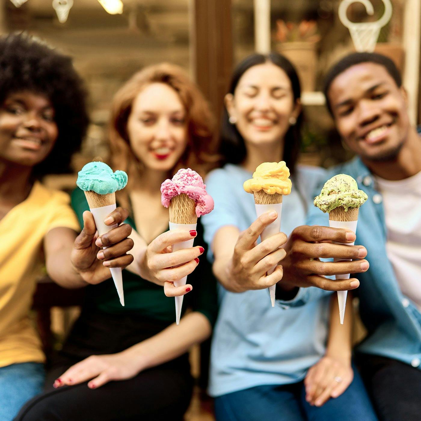 A group of friends holding ice cream cones